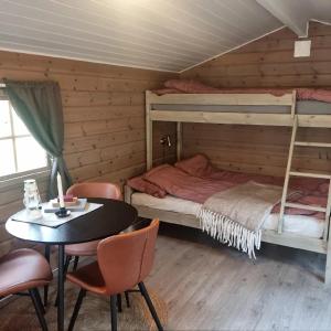 Postel nebo postele na pokoji v ubytování Tørfoss Gård, Hytte utleie, Campingvogn og bobil plasser