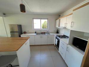 Kuchyň nebo kuchyňský kout v ubytování Duplex Résidence Cardano-jardin privé