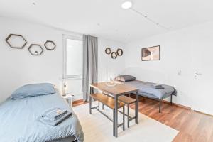Postel nebo postele na pokoji v ubytování ES02 schönes Apartment für Teams - 2 Schlafzimmer, 4 Einzelbetten, Nähe Messe