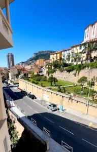 a view of a city street with cars on the road at Charming Flat at Monaco's Edge in Beausoleil