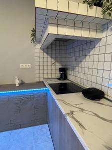 a kitchen with a sink and a counter top at Sunny house in Kremasti