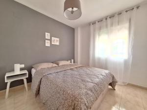 A bed or beds in a room at Playa Denia Még 18 kép