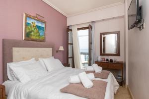 Postel nebo postele na pokoji v ubytování La Boheme Hotel