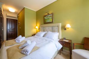 Postel nebo postele na pokoji v ubytování La Boheme Hotel