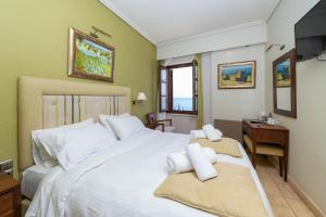 Postel nebo postele na pokoji v ubytování La Boheme Hotel