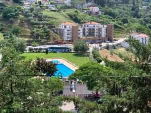 a view of a resort with a swimming pool at Casa da Lurdinhas in Tabuaço