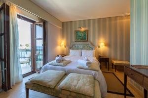 Postel nebo postele na pokoji v ubytování La Boheme Hotel