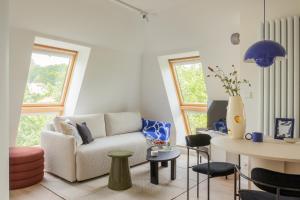 a living room with a couch and a table at Sopot M17 - by JWPM in Sopot