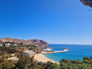 a view of a beach and the ocean at Al hoceima Center Apartment in Al Hoceïma