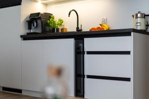 Kuchyň nebo kuchyňský kout v ubytování Sunset Resort, M3 Grzybowo + 14 fotografií