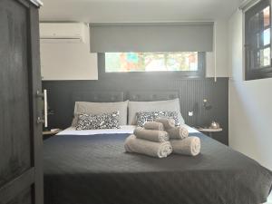 a bedroom with a bed with towels on it at B&B Marino in Grisolia