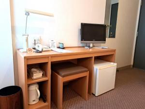 a desk with a computer and a monitor on it at Hotel Tetora Higashimuroran - Vacation STAY 75832v in Muroran
