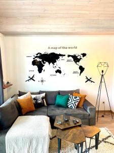 a map of the world wall sticker in a living room at Gemütliche Balkon-Oase mit Blick auf Skywalk in Stryck
