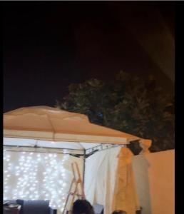 a white canopy with a tripod and some lights at Villa Malalien in Tetouan