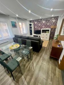 a living room with a couch and a table at Apartamento céntrico con terraza EBI02919 in Portugalete