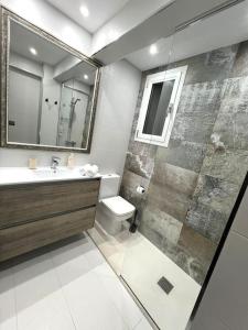 a bathroom with a shower and a sink and a toilet at Apartamento céntrico con terraza EBI02919 in Portugalete +15 photos
