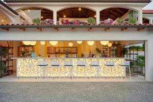 a restaurant with a bar in the middle of a building at Amadria Park Camping Trogir - Mobile Homes 2 in Seget Vranjica