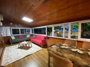 a living room with a couch and a table at Türkmen Apart in Demre