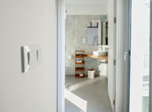 a bathroom with a sink and a mirror at O Souto da Aldea Ribeira Sacra Parada de Sil in Parada del Sil +30 photos