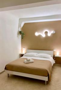 a bedroom with a bed with two towels on it at La Conchiglia in Lerici