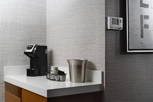 a coffee machine sitting on a shelf in a room at The STRAT Hotel, Casino & Tower in Las Vegas