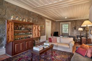 a living room with a couch and a table at Solar de Vilar Seco in Vilar Seco