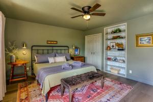 a bedroom with a bed and a ceiling fan at Pet-Friendly Escape with Game Room and Fire Pit! in North Fork