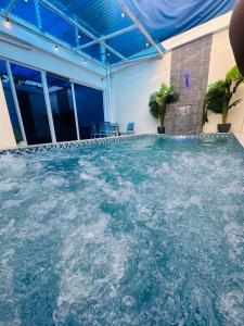 a large pool of water in a building at Casita ni Raphaella in Tacloban +11 photos