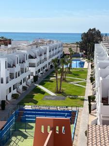 an aerial view of the hotel and the beach at Ático con vistas al mar y piscina privada in Vera