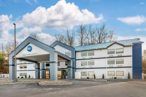 a large white building with a hospital at Best Western River Cities in Ashland