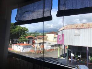 a view of a street from a window at Studio Poe Rava in Papeete