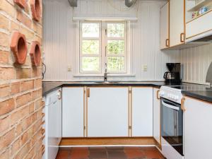 Kuchyň nebo kuchyňský kout v ubytování 14 person holiday home in Ulfborg + 37 fotografií