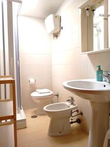 a bathroom with a toilet and a sink at MAREMEU TROPEA in Santa Domenica +43 photos