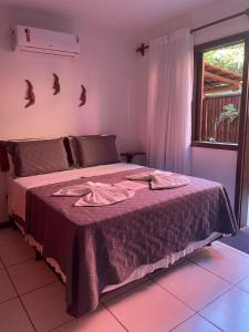 A bed or beds in a room at Bahia Bonita Flat