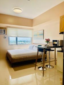 A bed or beds in a room at Classy Studio Unit at Aspira Towers
