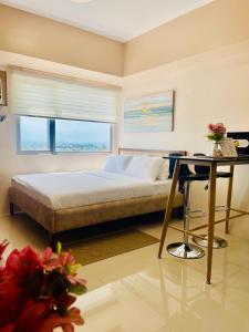 A bed or beds in a room at Classy Studio Unit at Aspira Towers