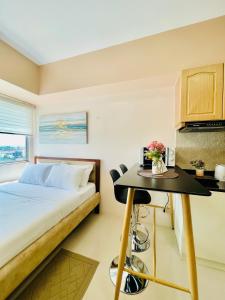A bed or beds in a room at Classy Studio Unit at Aspira Towers
