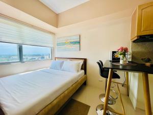 A bed or beds in a room at Classy Studio Unit at Aspira Towers