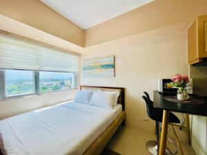 A bed or beds in a room at Classy Studio Unit at Aspira Towers
