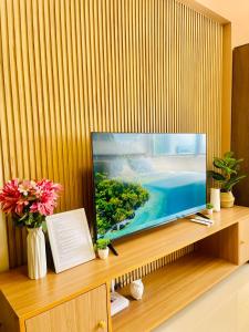 A television and/or entertainment centre at Classy Studio Unit at Aspira Towers