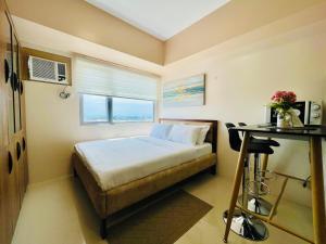 A bed or beds in a room at Classy Studio Unit at Aspira Towers