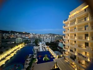 a view from the balcony of a building at night at Coastline Luxury Apart Hotel in Golem
