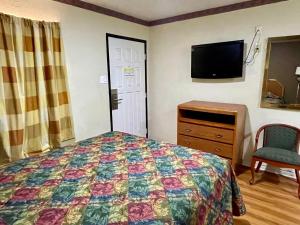 Postel nebo postele na pokoji v ubytování Ankur Inn Motel