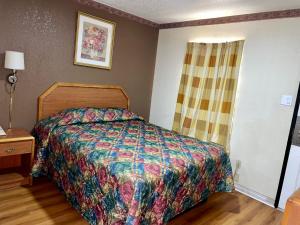 Postel nebo postele na pokoji v ubytování Ankur Inn Motel