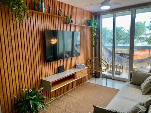 Μια τηλεόραση ή/και κέντρο ψυχαγωγίας στο Apartamento Praia Piratininga Vista Mar