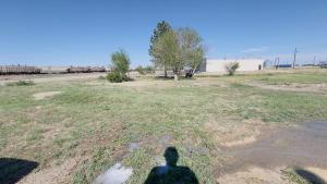 a shadow of a person standing in a field at RV Sites For Rent -Power-Water-Sewer-Wifi in Eads