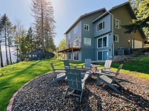 a group of chairs sitting in front of a house at Jaw Drop View! Mt Hood! Fire Pit, Family Friendly in Underwood