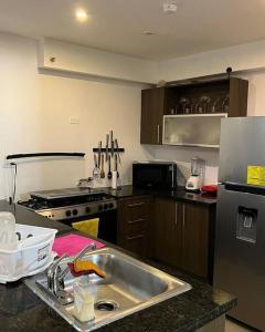 Kuchyň nebo kuchyňský kout v ubytování Apartamento con piscina + 1 fotografie