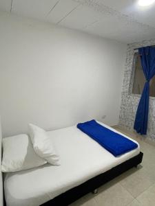 Кровать или кровати в номере Alojamiento en Armenia