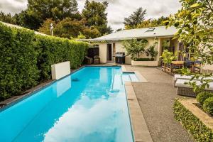 a swimming pool in the backyard of a house at Nestled amongst nature in Havelock North in Havelock North